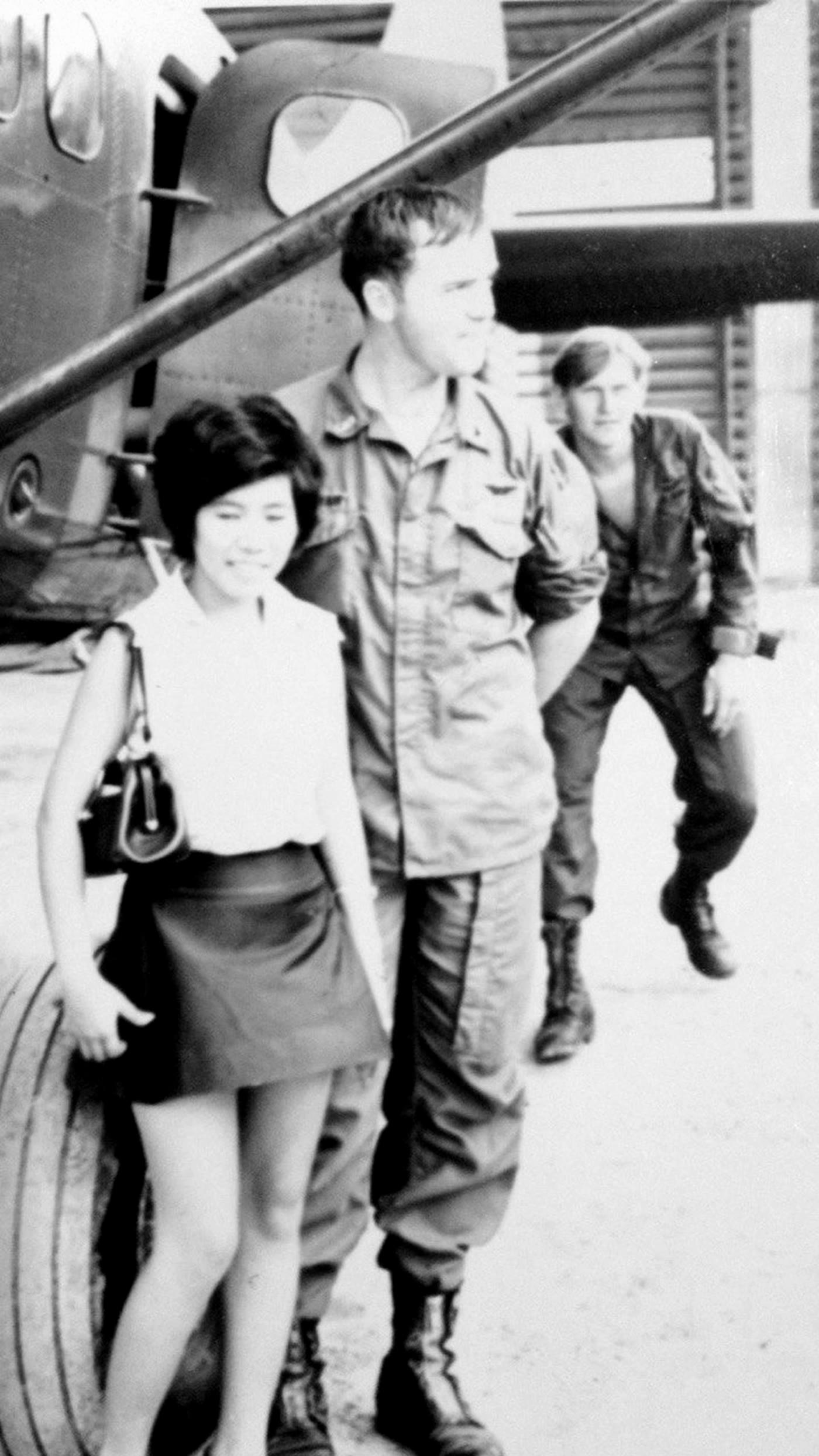 Del and Paula beside a military aircraft during their early years together